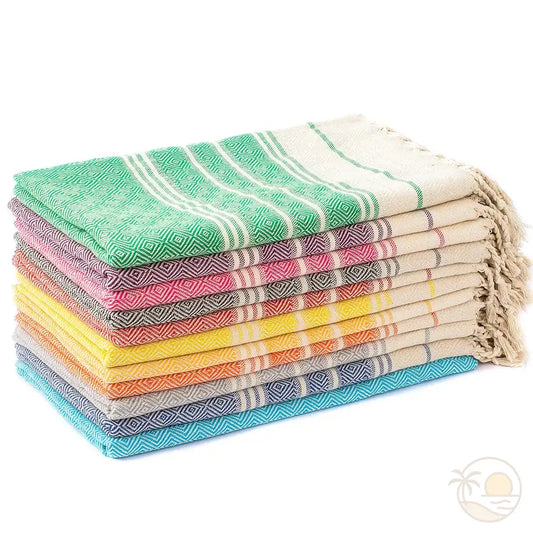 serviettes plage fouta bleu vert violet rose gris rouge pliees