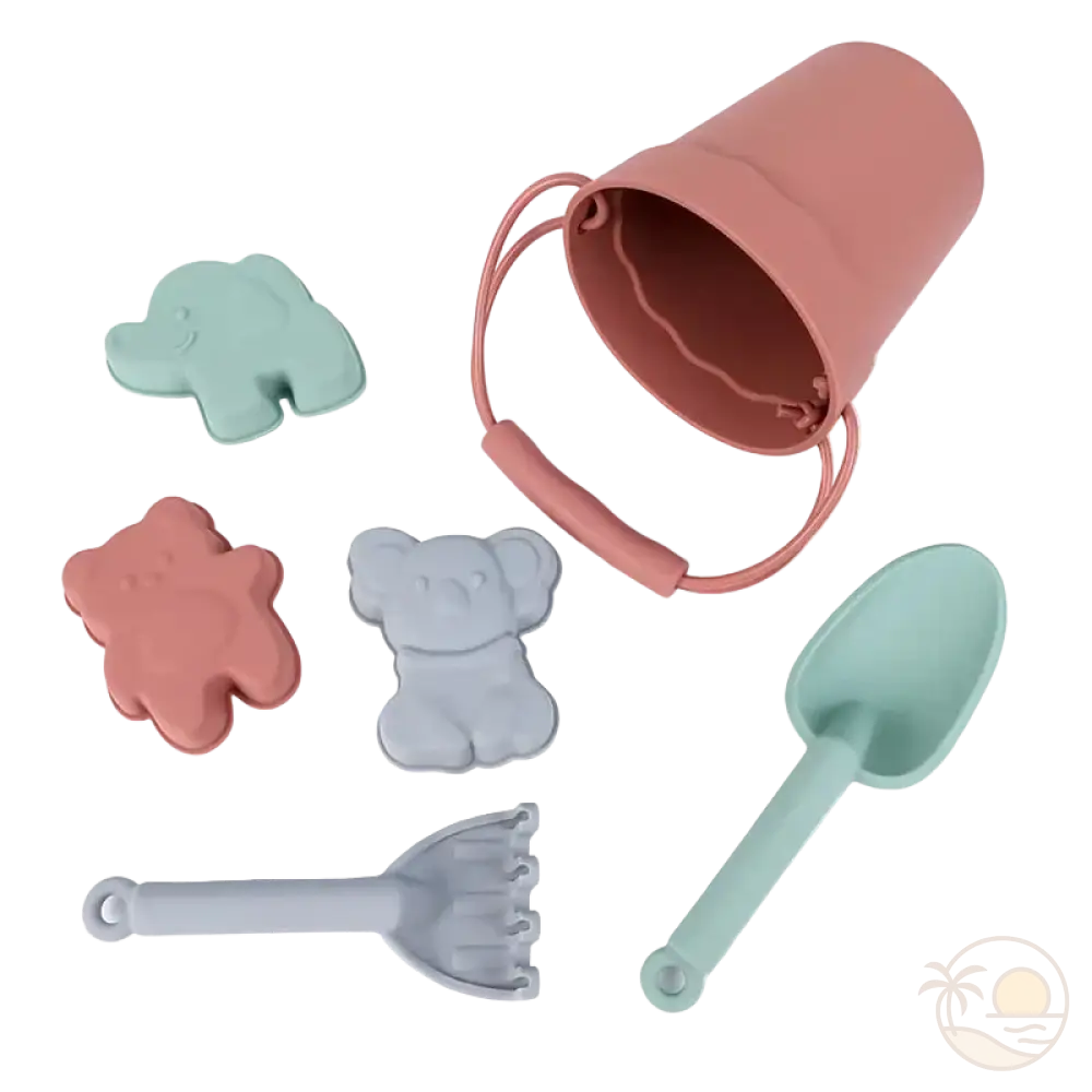 pelle et seau de plage rose