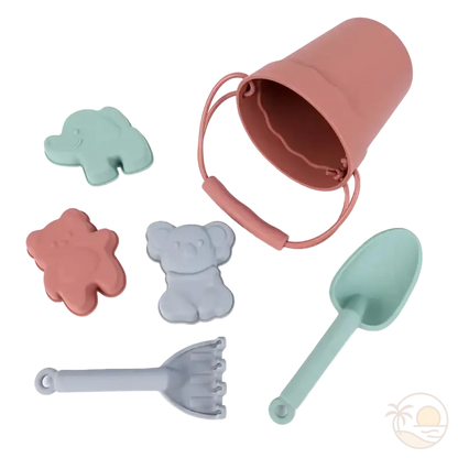 pelle et seau de plage rose