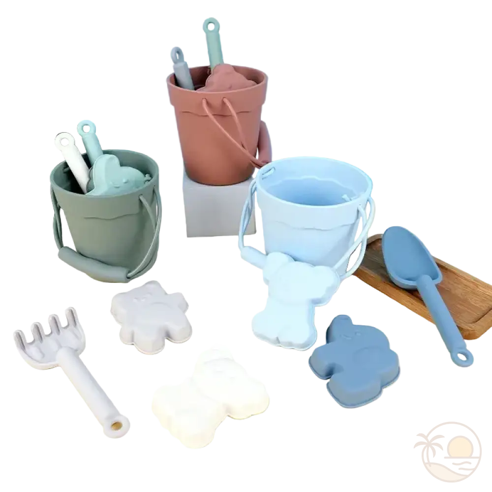 pelle et seau de plage vert rose bleu moules