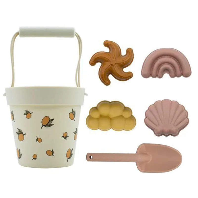 pelle seau plage citrons