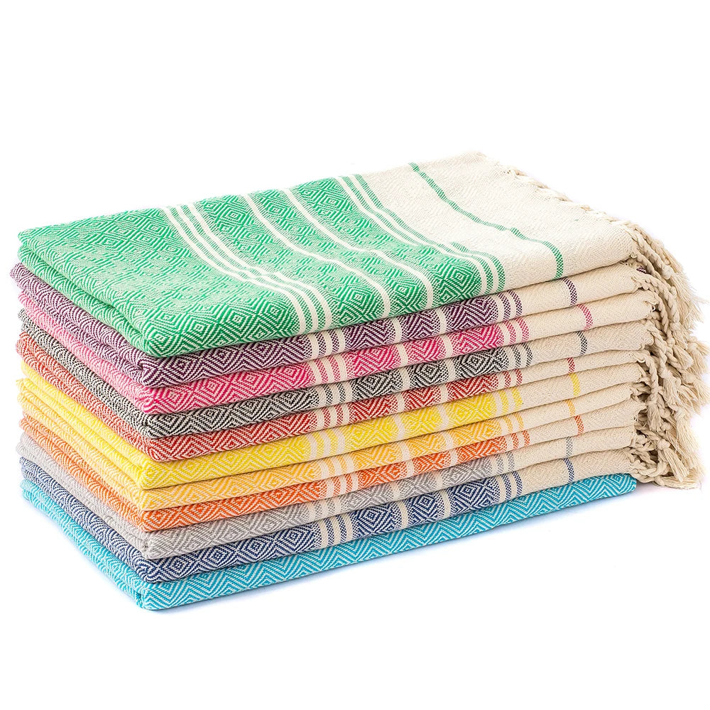 serviettes plage fouta bleu vert violet rose gris rouge pliees