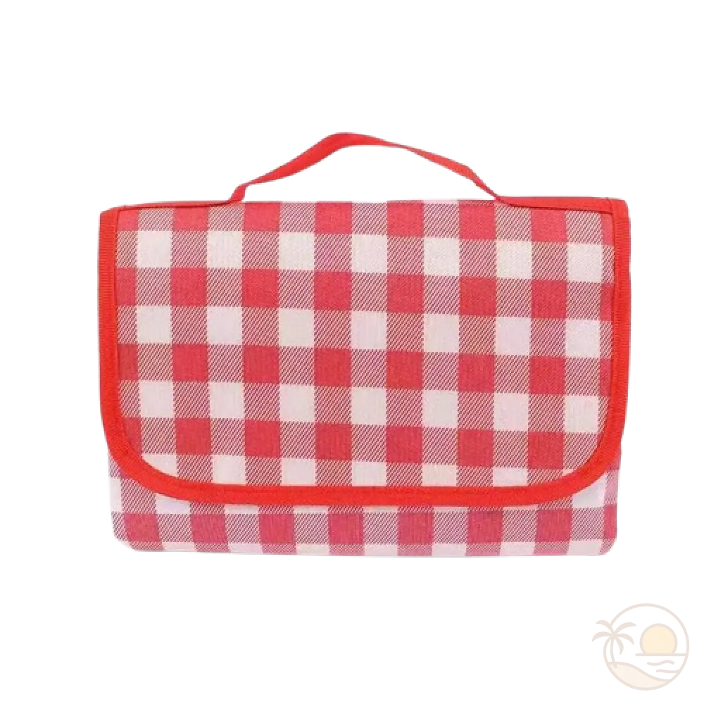 tapis de plage rouge plie