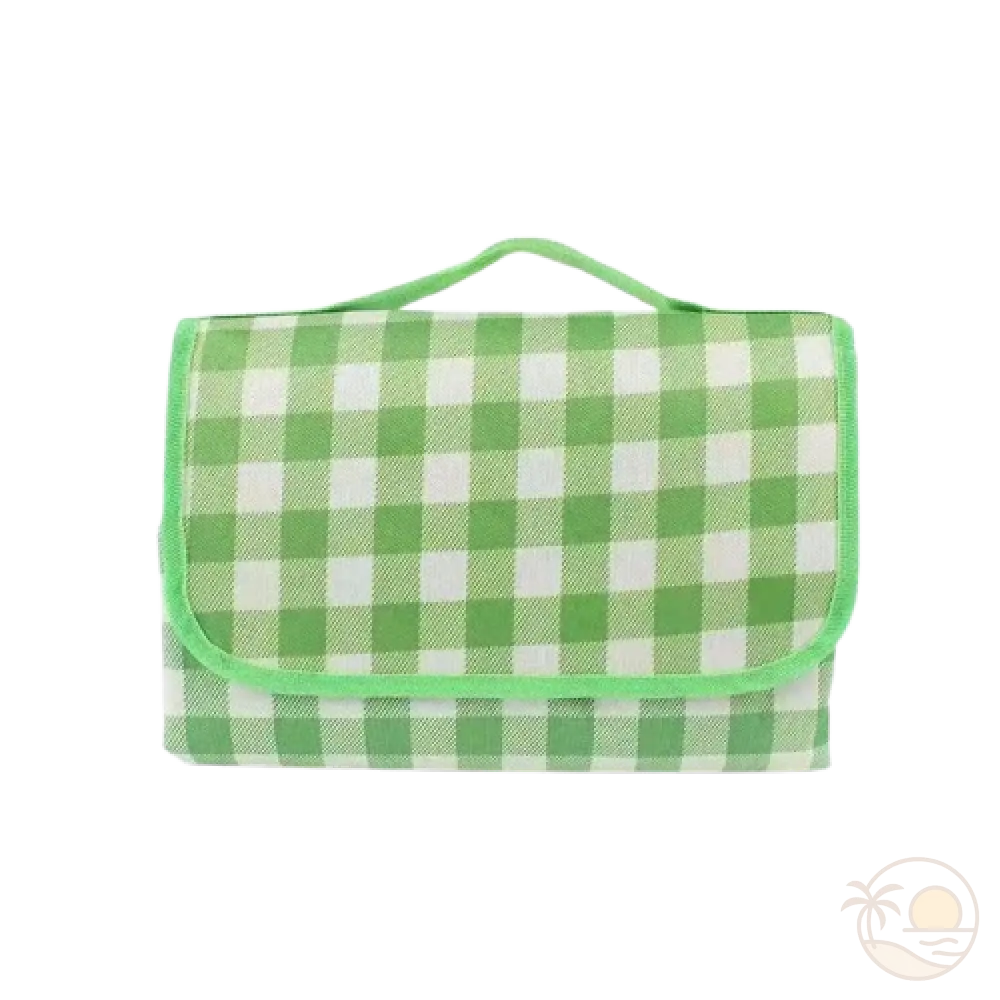 tapis de plage vert plie