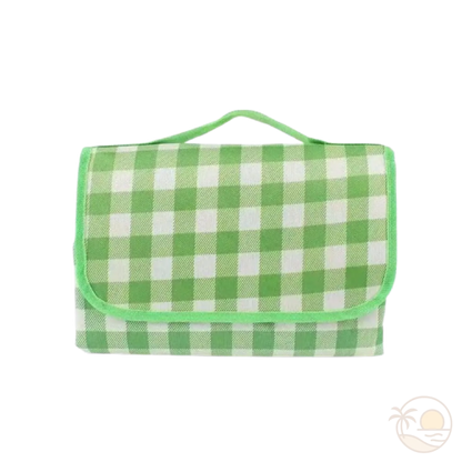 tapis de plage vert plie